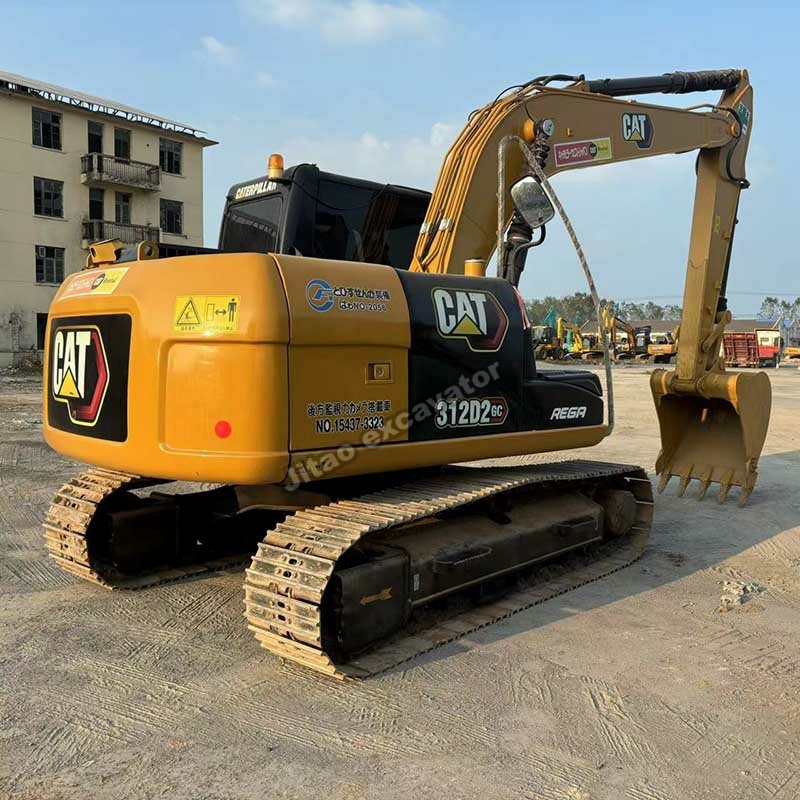 Detailed view of the hydraulic boom and arm assembly of a Cat 312D2 GC.