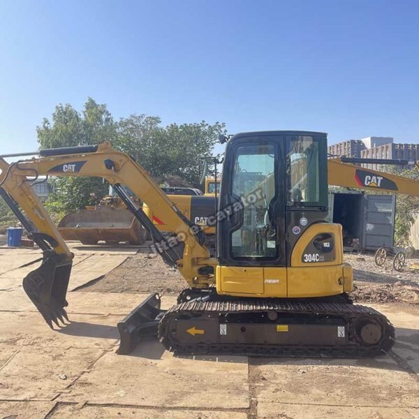 Side view of a yellow CAT 304CR used mini excavator for sale.