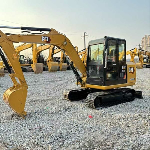 CAT 305.5E2 Used Excavato Side view of a yellow CAT 305.5E2 used compact excavator for sale.