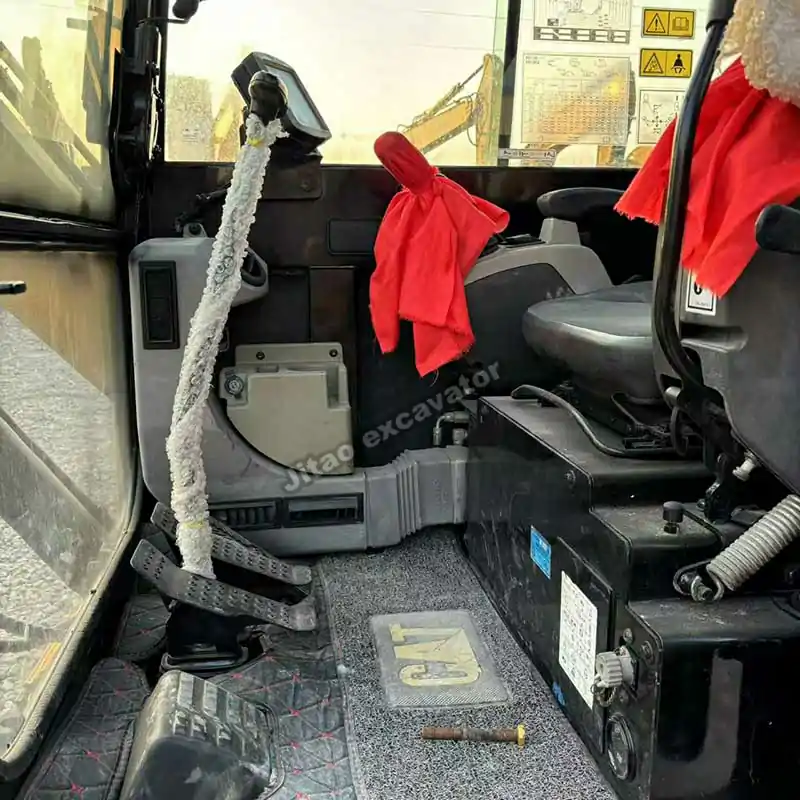 Clean cabin interior of a used Cat 305.5E2 mini excavator for sale.