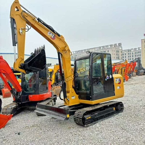 CAT 306 Profile View Side profile of a yellow CAT 306 mini excavator for sale used.