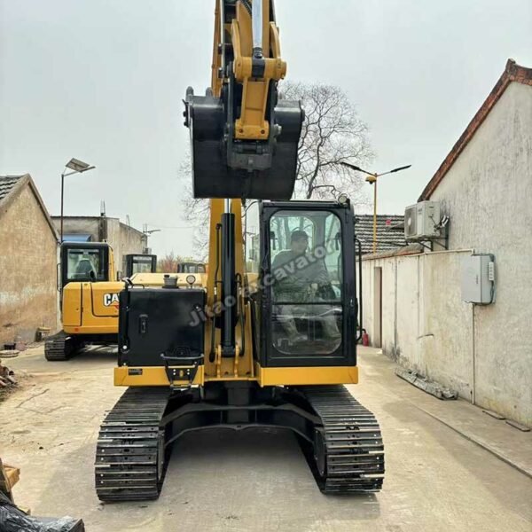 CAT 307.5 Front Profile Front view of a yellow CAT 307.5 from our collection of mini excavators for sale used.