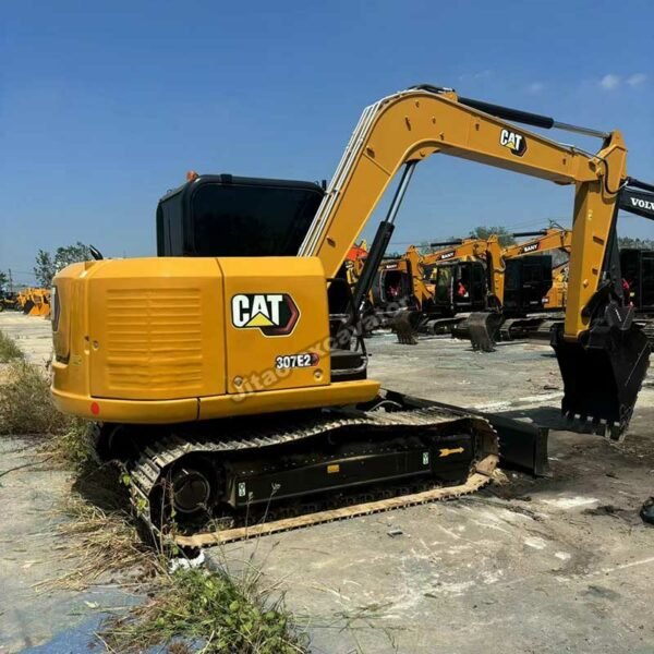 Rear-side view of a CAT 307E2 excavator featuring high-quality used cat engines for sale.