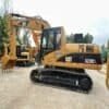 Cat 320CL Overview Side profile of yellow Cat 320CL, a heavy-duty hole digger used machine.