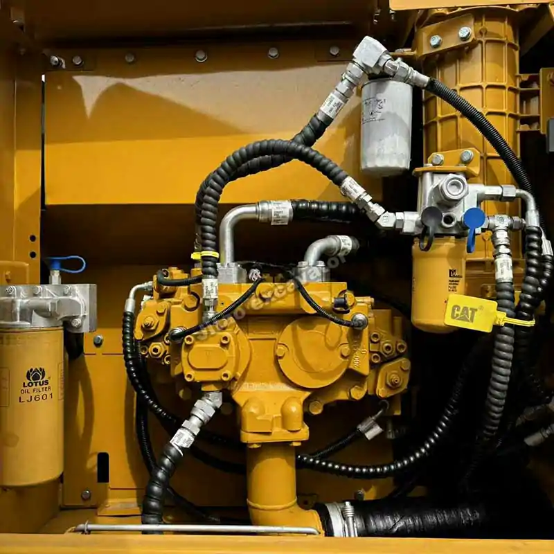 Interior view of the Cat 320D main hydraulic pump and filters.