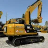 Side profile of yellow Cat 320D, a popular used excavator for sale.
