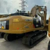 Rear angle view of a clean Cat 324D2 excavator with original paint.