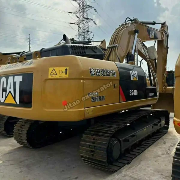 Rear angle view of a clean Cat 324D2 excavator with original paint.