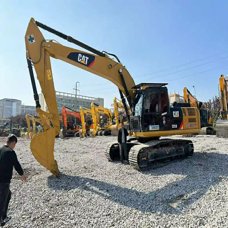 Front side view of a Cat 325D, a great choice for used excavator sales near me.