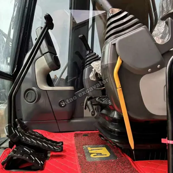 Interior view of the Cat 329D cabin showing joystick and clean seat.