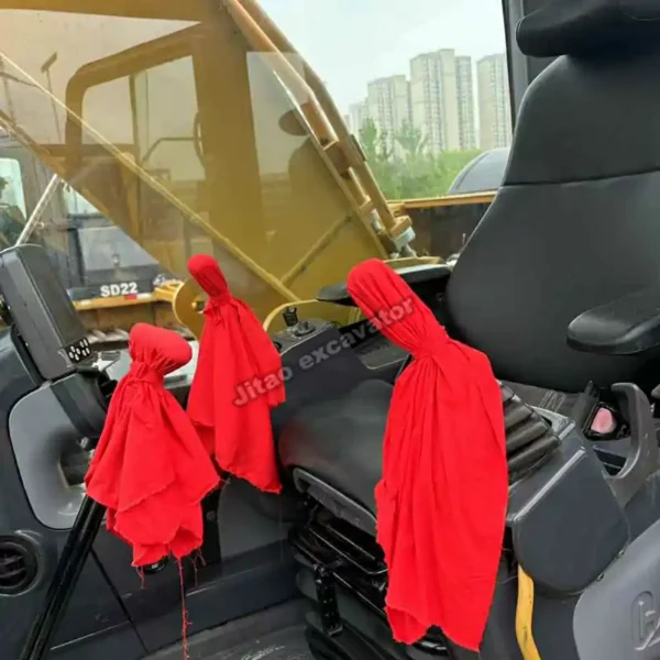 Interior view of Cat 329D2L cabin showing the joystick and seat.