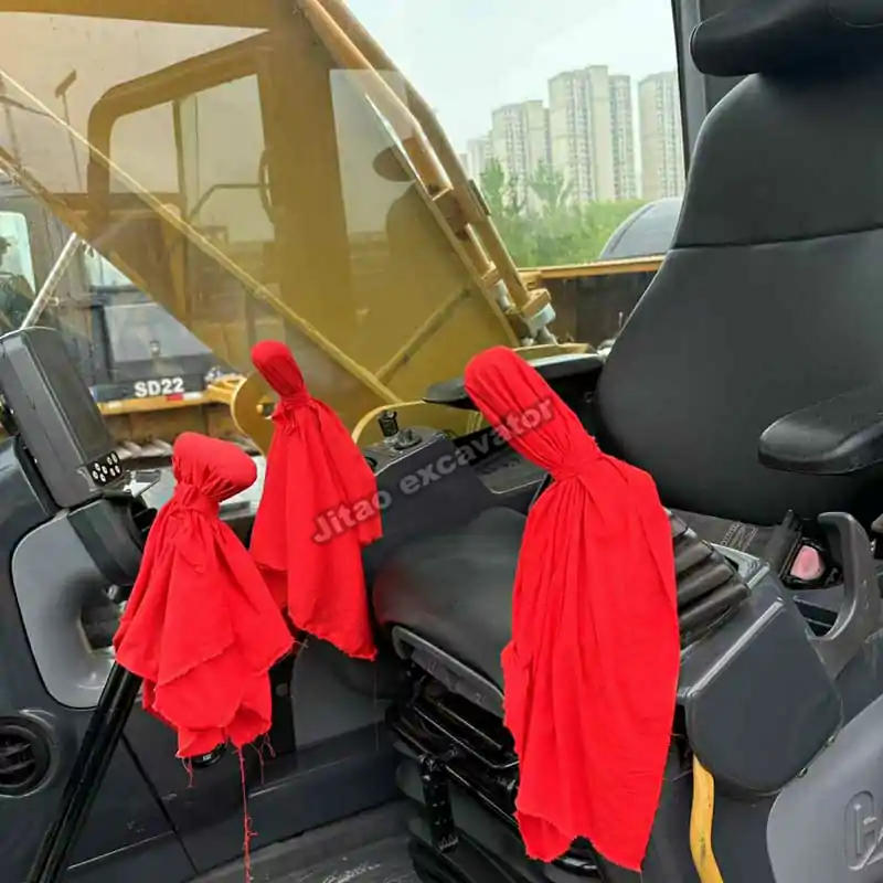 Interior view of Cat 329D2L cabin showing the joystick and seat.