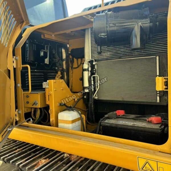 Cat 315D2 Engine Bay Interior view of the clean Caterpillar engine in a 15-ton excavator.