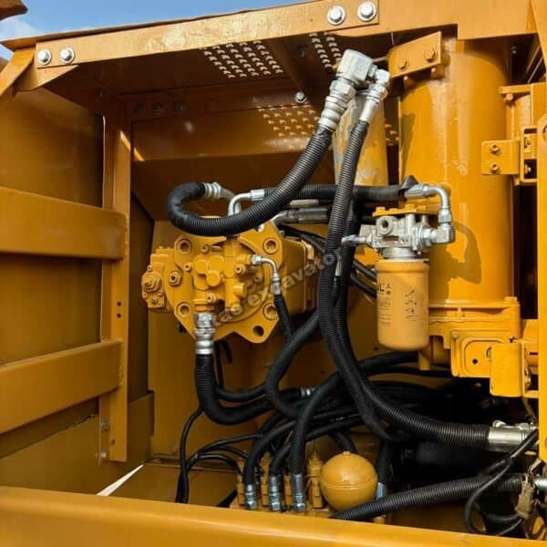 Interior view of the Cat 320BL main hydraulic pump and filter.