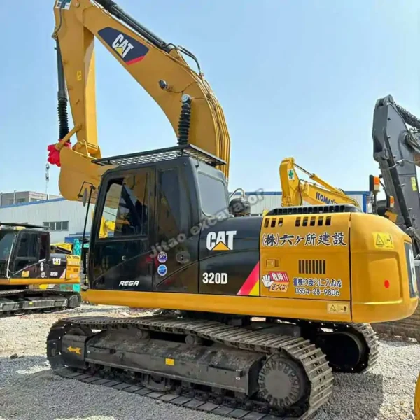 Full side view of a clean Caterpillar 320D with original paint.