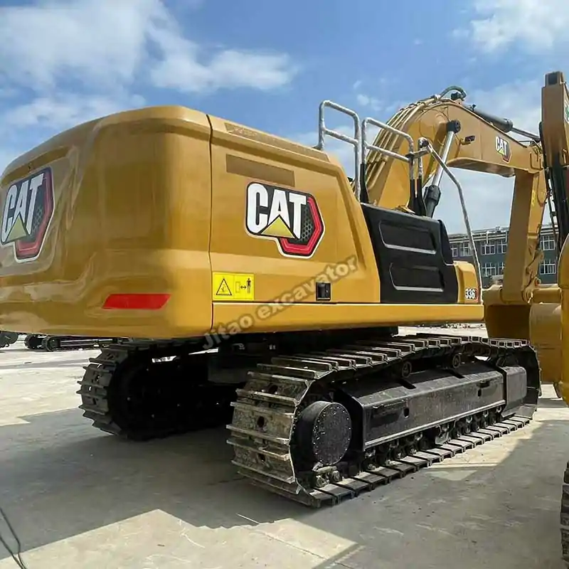 Rear-side view showing the durable tracks and chassis of the Cat 336.