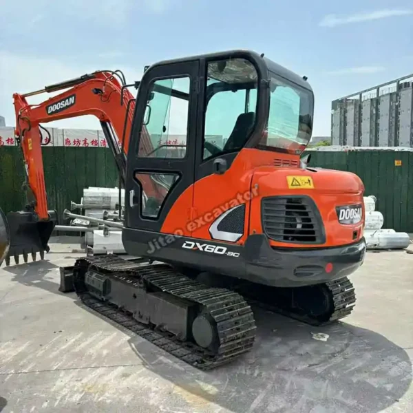Front-quarter view of the Doosan DX60, verified and job-ready.