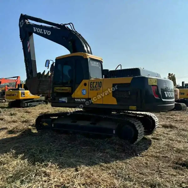 Rear angle of the EC210, illustrating why Jitao is the premier source for excavator parts used.