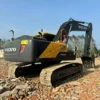 Full side view of a Volvo EC240, an alternative to buying a standalone used excavator bucket for sale.