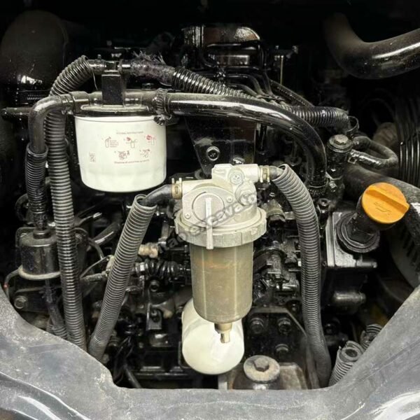 PC35 Engine Maintenance Detailed view of the clean engine and filters of a Komatsu PC35 excavator.