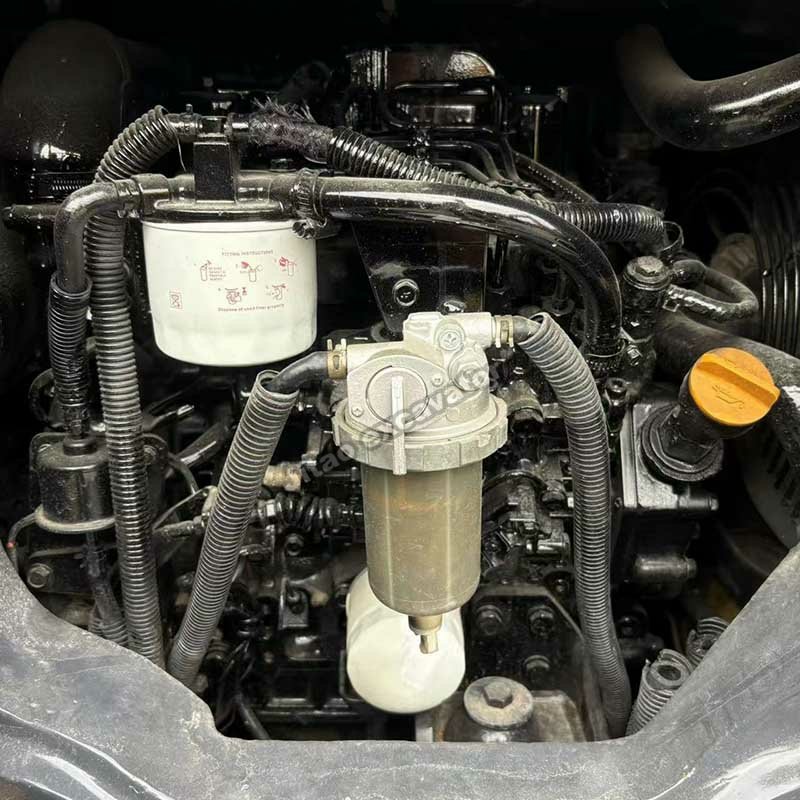 Detailed view of the clean engine and filters of a Komatsu PC35 excavator.