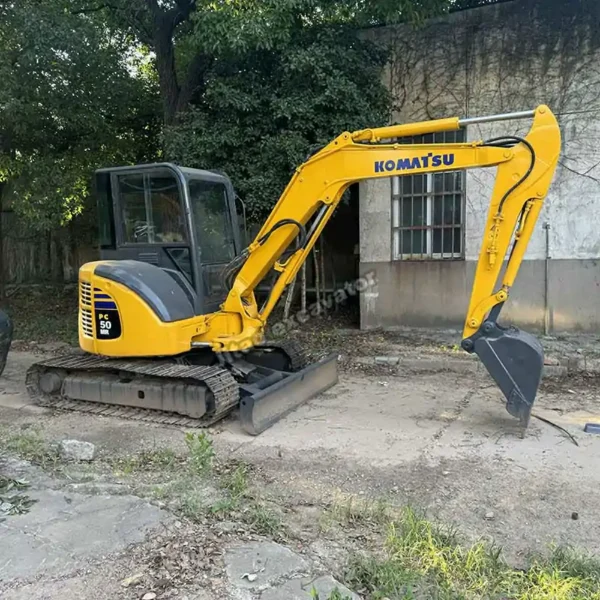 Certified PC50MR Side Shot Side profile showing the arm of this mini excavator for sale used.