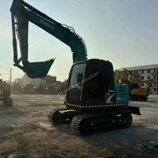 Angle view of the Kobelco SK75 crawler tracks and upper structure.