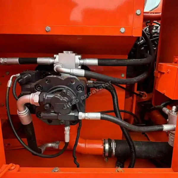 Detailed view of the hydraulic pump and engine compartment in a Doosan DX150.