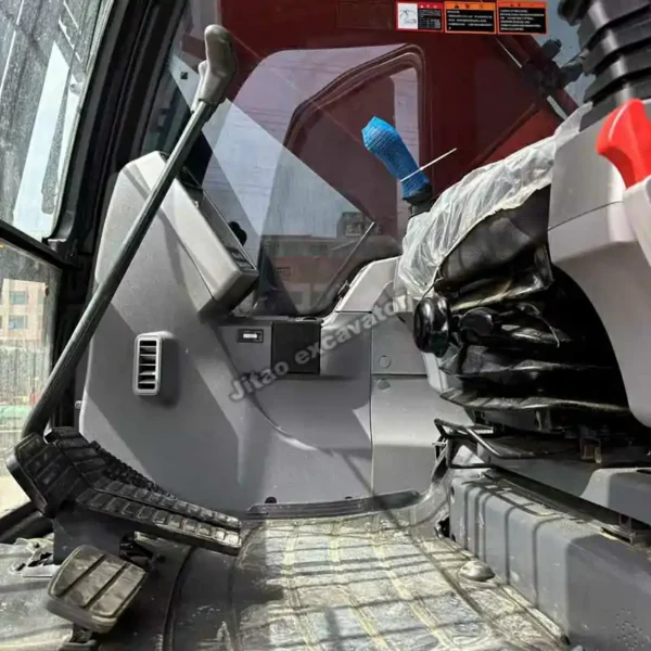 Interior view of the clean and ergonomic operator cabin of the Doosan DX225.