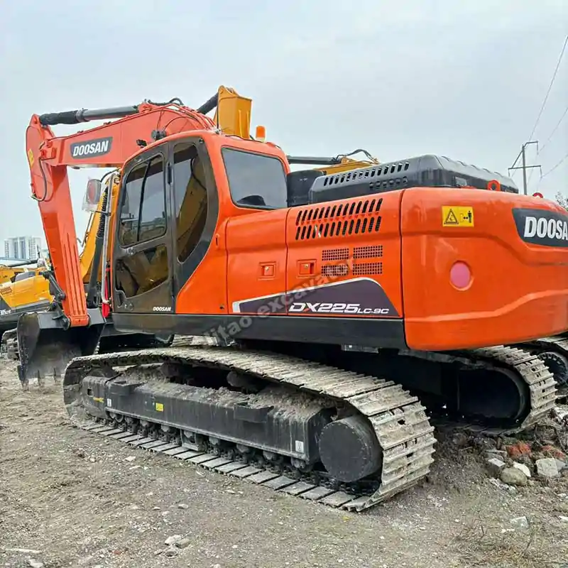 Rear angle of the Doosan DX225LC-9C, highlighting its clean exterior.