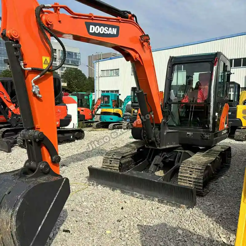 Front view of a Doosan DX60 for buyers seeking used mini excavators for sale near me by owner.