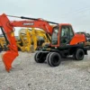 45-degree angle of an export-ready wheeled excavator for sale.