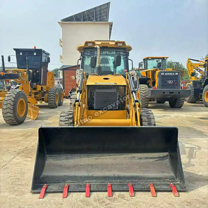 Front loading bucket view of an export-ready backhoe loader.