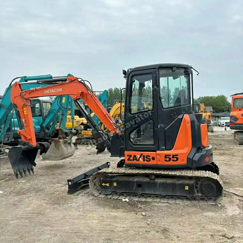 Side perspective of the used mini excavator near me at our yard.