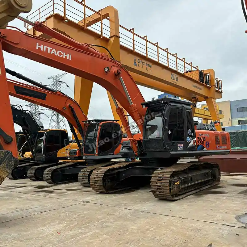 Hitachi ZX350 equipped with a used excavator thumb for demolition.