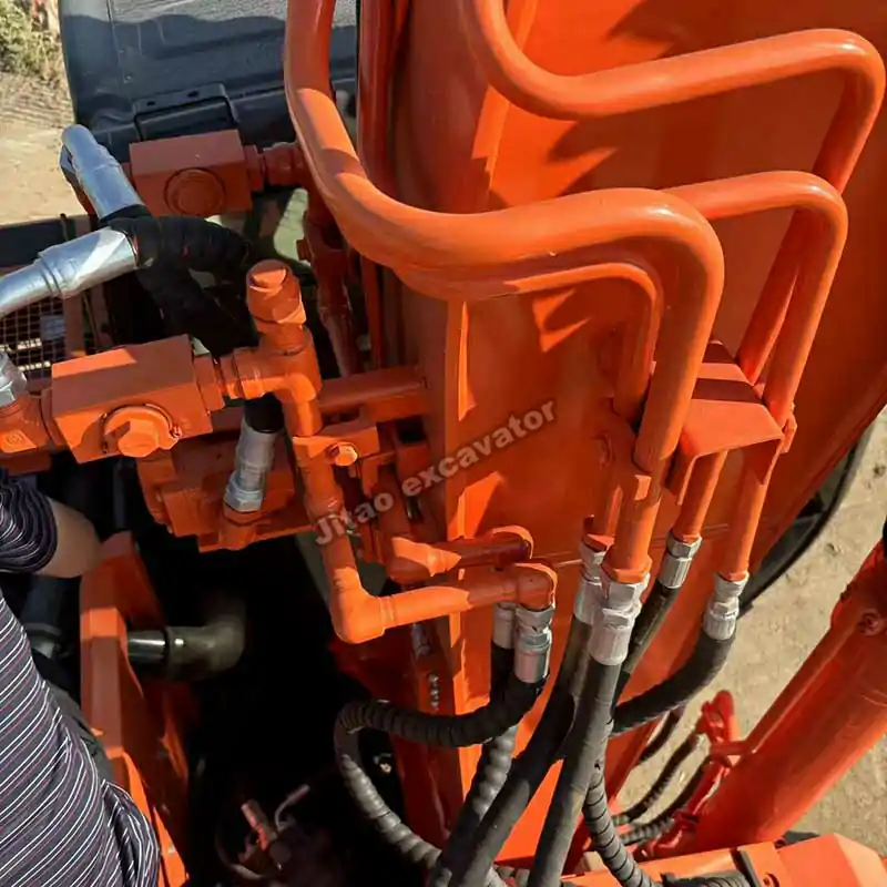 Detailed close-up of the hydraulic hitachi excavator parts on ZX135US.