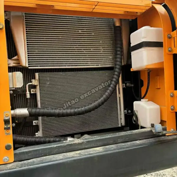 R220-9S Engine Bay Detailed view of the engine cooling block. Reliable hyundai excavator power.