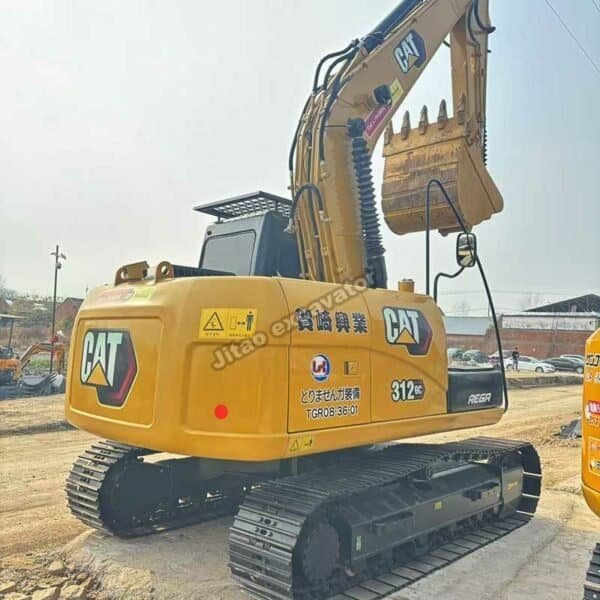 Cat 312 GC Rear Profile Rear-side profile showing the original paint and decals of a Cat 312 GC.