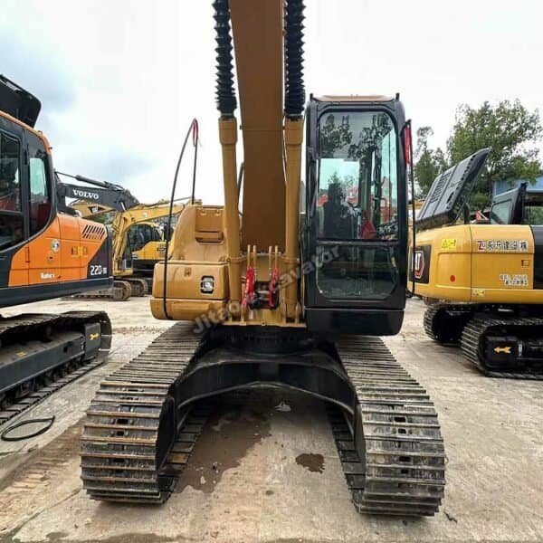 Robust Track System Front view showing the heavy-duty tracks and chassis of the Cat 320CL.