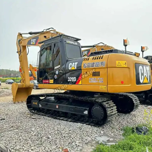 View of the steel tracks and chassis of the Cat 320D excavator.