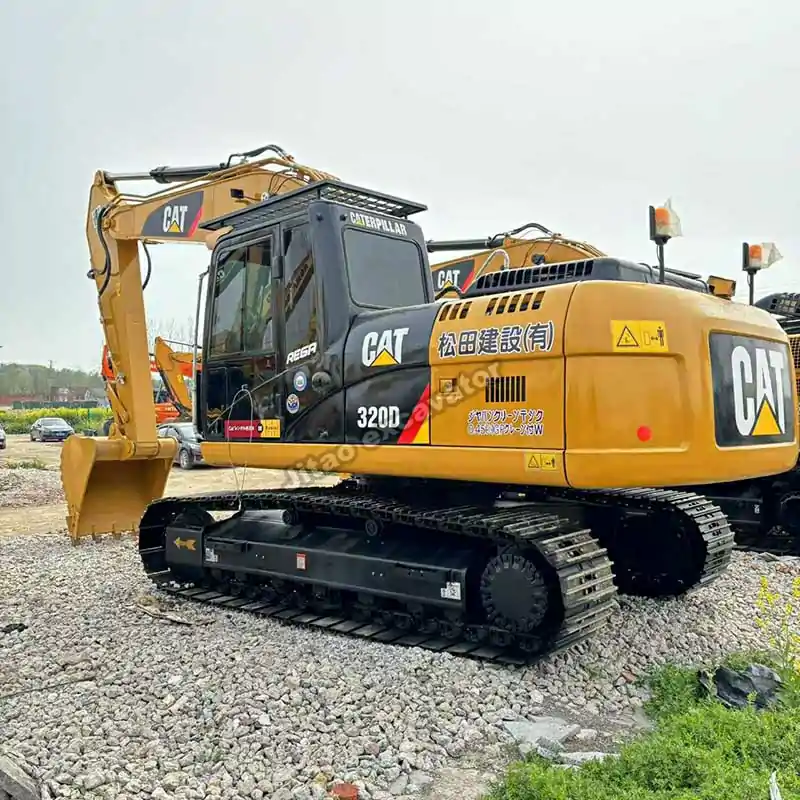 View of the steel tracks and chassis of the Cat 320D excavator.