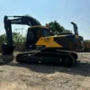 Profile view of EC290 highlighting its arm. Sourcing used excavator buckets for sale near me.