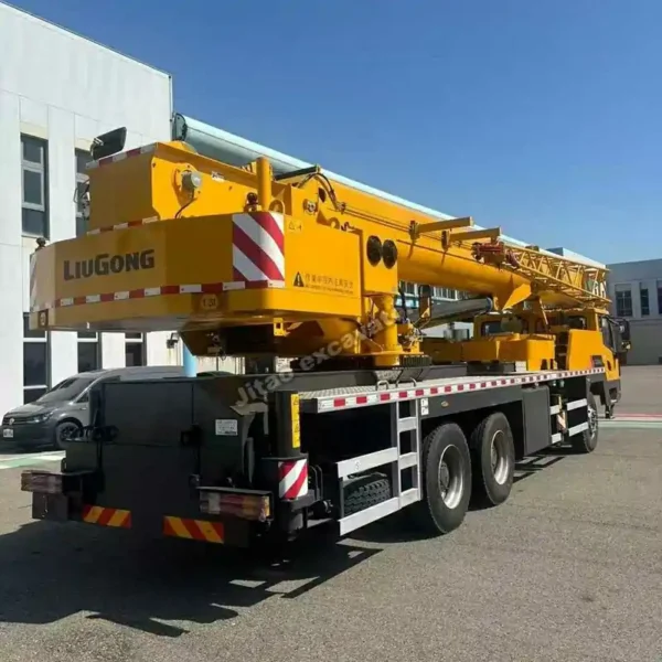 Rear view showing the boom and chassis of a certified mobile crane.
