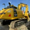 Perspective view of a clean PC120, perfect for those searching used mini excavators for sale near me.