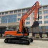 Full side profile of the Doosan DX300LC with reinforced boom and arm.