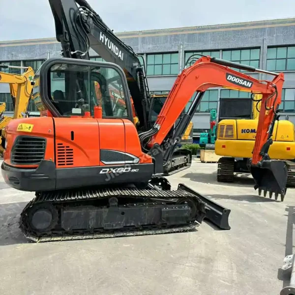 Side angle of the Doosan DX60 mini excavator showing its compact design.