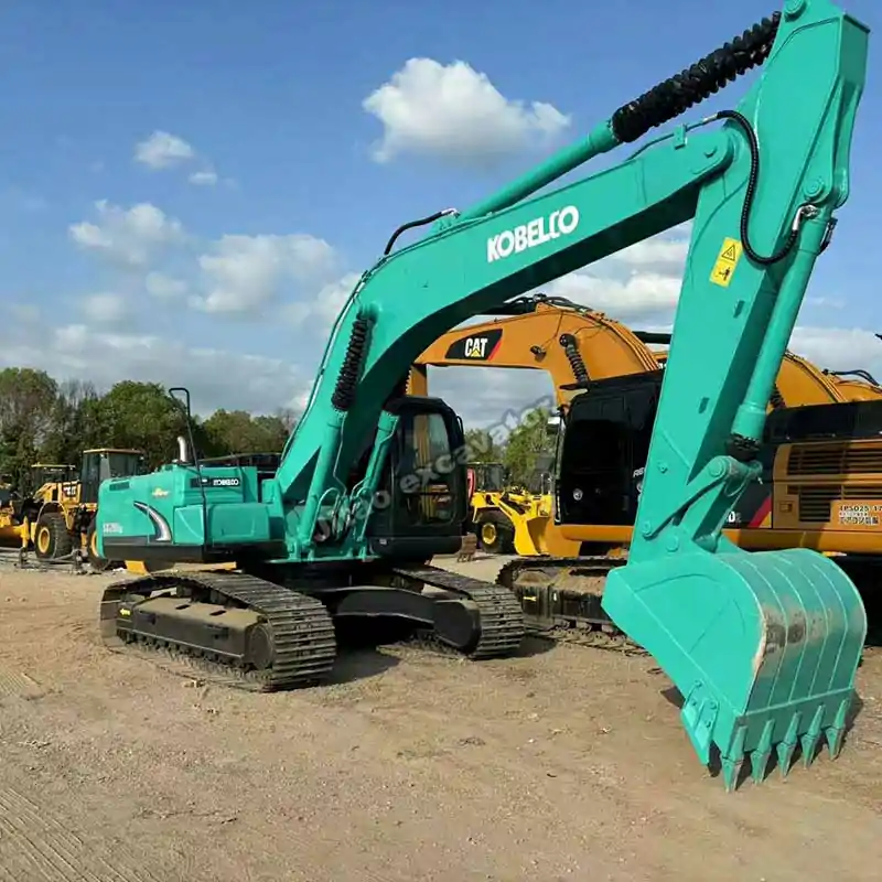 Three-quarter view of Kobelco SK260 crawler showcased in our used mini excavator for sale yard.