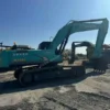 Side profile of Kobelco SK350 available in our certified used excavators for sale yard.