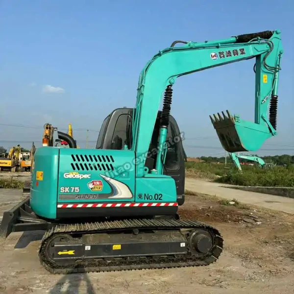 Side view of the Kobelco SK75 showcasing its pristine condition and durable boom.