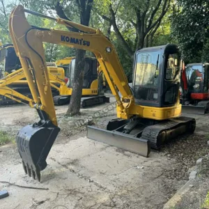 Side view of a Komatsu PC50MR, a premier mini excavator for sale used.